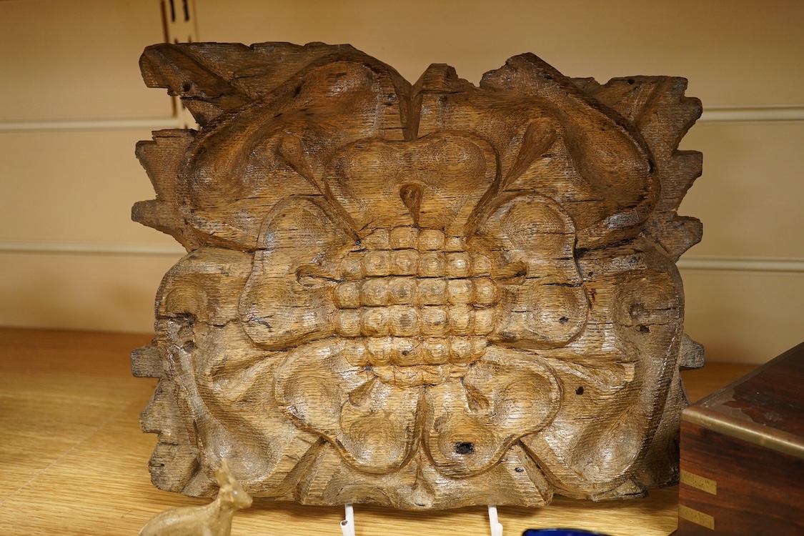 A carving of a Tudor rose-30cm wide, a brass bound box, small brass box, two eye baths, a green malachite ashtray etc